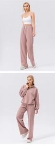 Close-up of pink waffle knit sports set with half-zip sweatshirt and wide-leg sweatpants