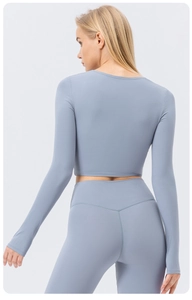 Rear view of sleek morandi blue yoga set featuring high-stretch fabric and slim-fit cut