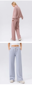 Detail view of high-waist wide-leg sweatpants featuring adjustable drawstring waistbands