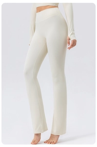 Cream white high-waisted flared yoga pants with tummy control and sleek matte finish