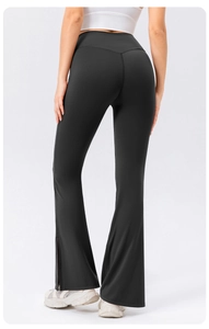 Close-up of high-waisted flared yoga pants featuring back V-cut waist and side slit hem