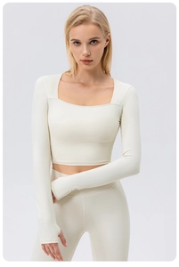 Detail of square neck yoga top with long sleeves and thumbholes in cream white