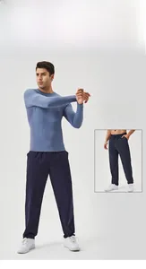 Detail of grey-blue quick-dry athletic long sleeve top and navy drawstring sports pants
