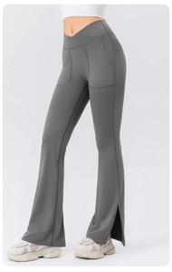 Detail of cross high waist design and side pocket on flare yoga pants in charcoal gray