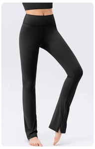 Macro detail of high waist yoga pants showing side slit leg and premium matte texture