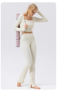Detail of square neck long sleeve yoga top and flare pants set in creamy white