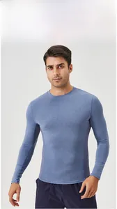 Detail of blue men's compression shirt showing side breathable mesh and elastic fabric