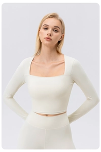 Detail of square neck long sleeve yoga top and high waist leggings in creamy white
