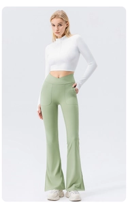 Close-up of high-waisted flared yoga pants with V-shaped crossover waist and side pocket