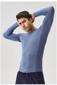 Detail of light blue dry-fit athletic shirt with breathable dark blue mesh side panels