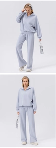 Detail of lavender half-zip sweatshirt and wide-leg joggers set for women fitness