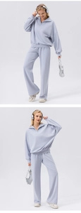 Detail of light blue wide-leg sports trousers with a high-waist cut and knit texture
