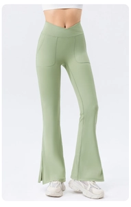 Detail of high waisted yoga flare pants with V-cross waist and side slit hem design