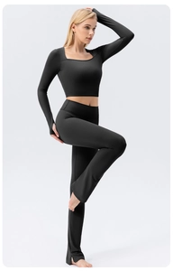 Close-up of black yoga top with U-neck and thumb holes made of high-stretch fabric