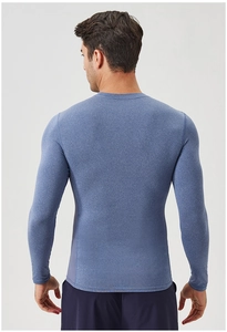 Back view of men's sky blue compression running shirt showing elastic athletic fabric