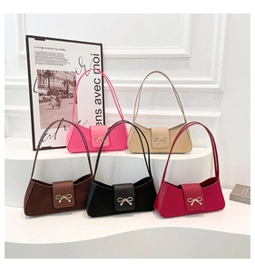 Detailed shot of bow-knot buckle crossbody bags in multiple colors for 2025 fashion style