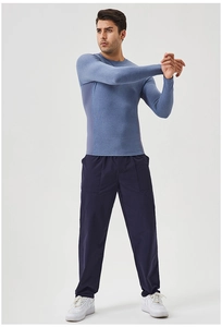 Men's light blue long sleeve compression top and navy pants for fitness and running