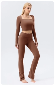 Detail of square neck yoga top with thumbhole cuffs and high-waist flared pants set