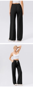 Detail of high waist wide leg sweatpants with white drawstring and breathable fabric texture
