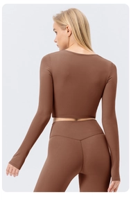 Detailed back view of brown yoga set with V-shaped stitching for lifting effect