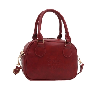 Vintage red bowling handbag in lychee grain PU leather with dual handles and gold hardware