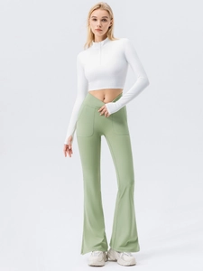 Women flared yoga pants with cross waist and green leggings paired with a white jacket