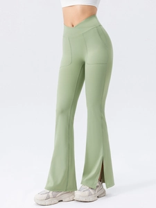 Sage green flared yoga pants with high-waist crossover design and side pockets