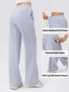 Pantaloni sportivi azzurri a gamba larga in tessuto a nido d'ape con vita alta elastica