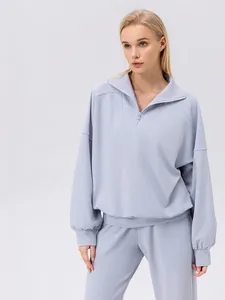 Women's light purple half-zip sports sweatshirt and joggers set with a loose fit