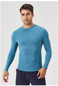 Detailed view of breathable mesh texture on blue long sleeve compression sports shirt