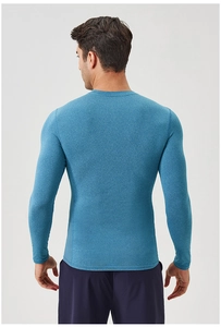 Rear view of men's athletic compression shirt in space dye blue with slim fit cut