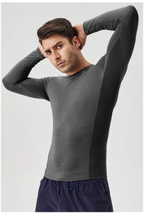 Detail view of men's quick-dry fitness shirt with grey marl texture and black side panels