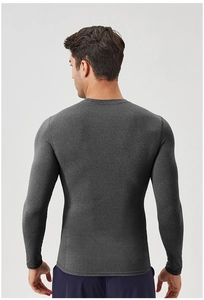 Detail of dark grey breathable long-sleeve compression shirt showing knit texture