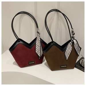 Detail of vintage solid color tote bags with silk scarves and stylish V-shape opening