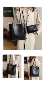 Detail view of large black tote bag and matching pouch set with golden logo print