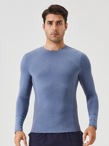 Men's blue quick-dry long sleeve athletic shirt with breathable side panels for fitness