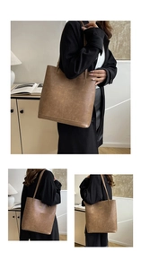 Detailed view of brown tote bag featuring retro matte leather texture and long shoulder straps