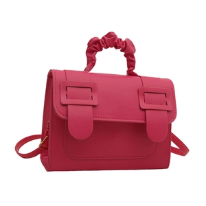 Magenta pleated handle crossbody bag with square buckles and adjustable strap
