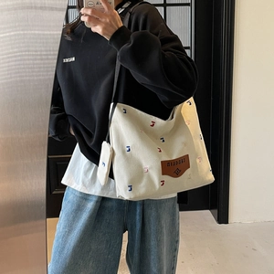 Large casual beige canvas bucket bag with colorful J-letter embroidery for daily use