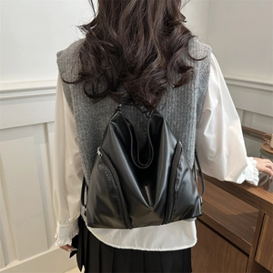 Women's vintage black PU tote bag with stylish triangular cut and vertical zippers