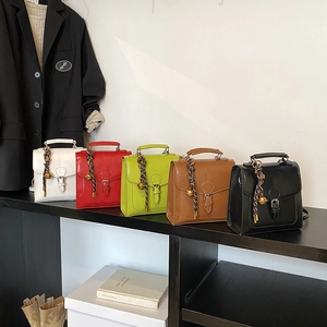 Classic rectangular handbags in five colors with woven charms and top handles for women