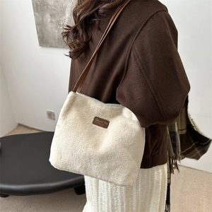 White faux fur tote bag with brown leather straps and patch for autumn winter fashion