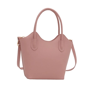 Chic dusty rose leather bucket bag with top handles and adjustable crossbody strap