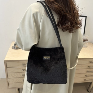 Fashionable black faux fur tote bag for women with New York label in casual street style