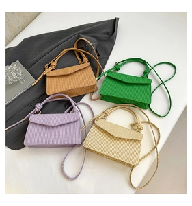 Chic woven tote bags in caramel, green, lavender, and beige colors with knot handles