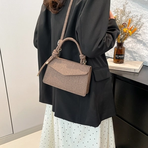 Brown and beige houndstooth crossbody bag with woven handle for fashion casual style