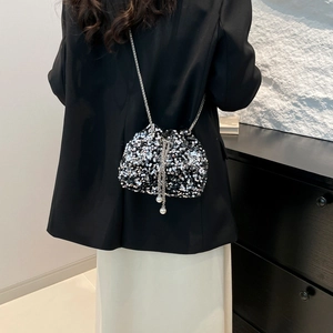 Sparkly silver and black sequin bucket bag with drawstring and elegant chain strap