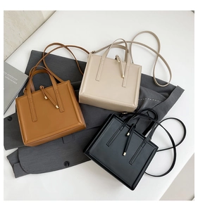 Minimalist crossbody bags in brown, beige, and black leather with tassel detail