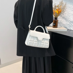 White quilted shoulder bag with checkered texture and gold hardware for women