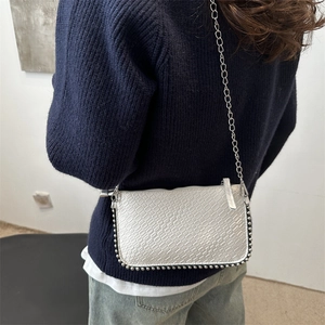 Silver metallic woven texture crossbody bag with beaded trim and chain strap